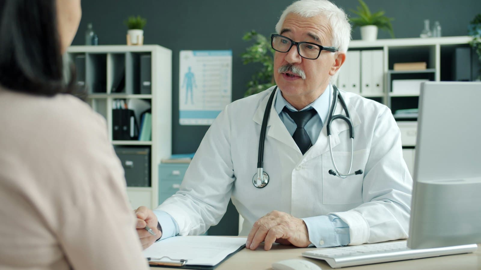 Doctor talking with a patient during an office visit